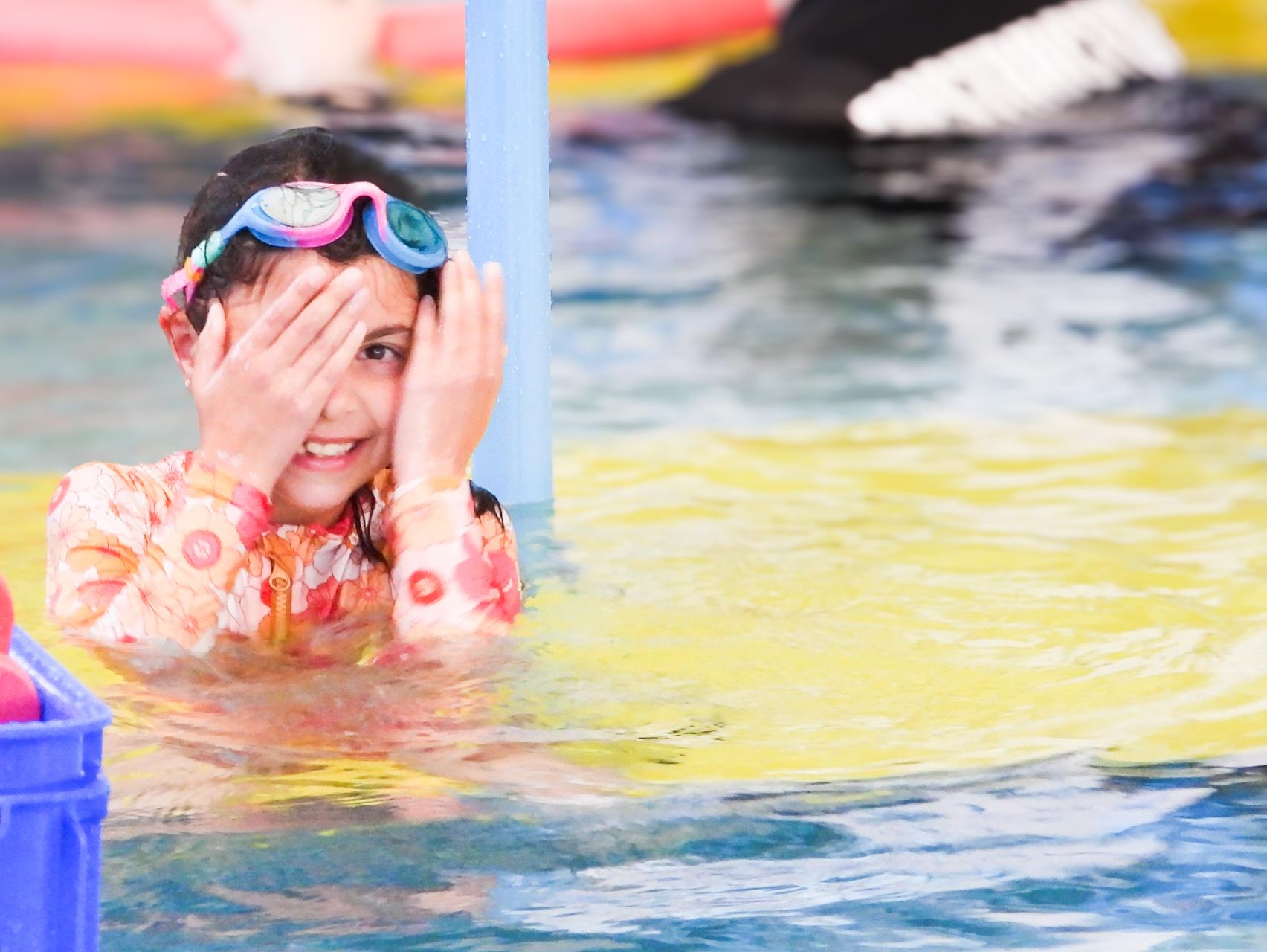 Girl sitting in Swim School Class